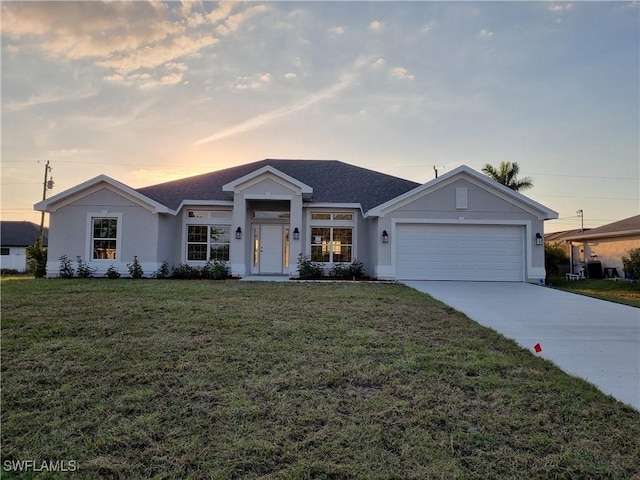 ranch-style house featuring an attached garage, a shingled roof, concrete driveway, stucco siding, and a front lawn