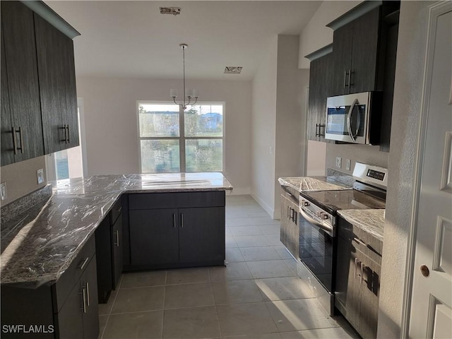 kitchen with stainless steel appliances, visible vents, light tile patterned flooring, light stone countertops, and a peninsula