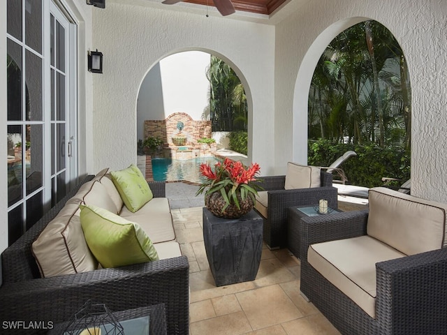 view of patio with french doors, ceiling fan, and an outdoor living space