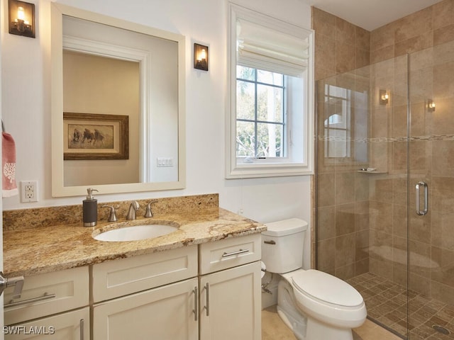 bathroom featuring walk in shower, vanity, and toilet