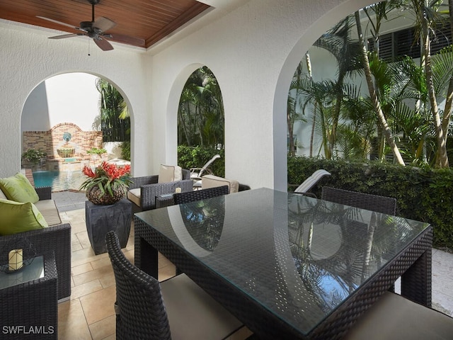 view of patio featuring ceiling fan