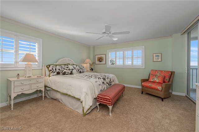 bedroom with multiple windows, light colored carpet, and ceiling fan