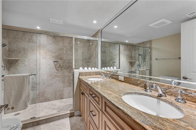 bathroom with tile patterned flooring, vanity, toilet, and walk in shower