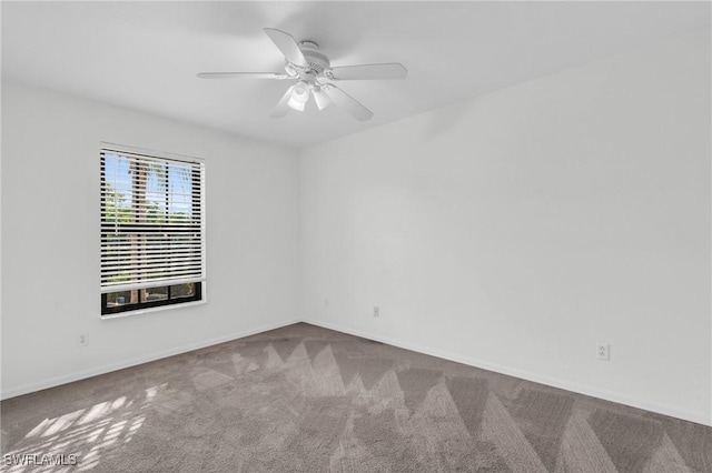 spare room with carpet flooring and ceiling fan