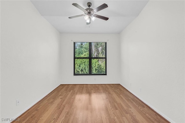 spare room featuring ceiling fan and light wood-type flooring