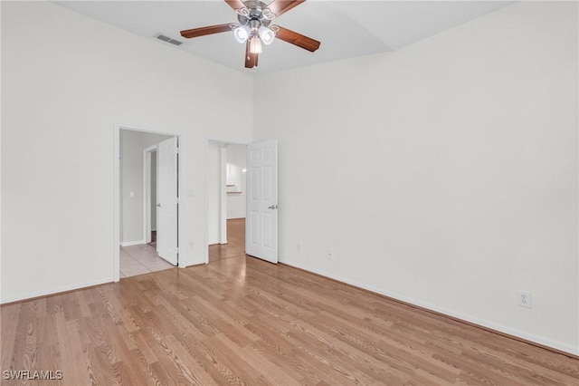 unfurnished bedroom featuring ceiling fan and light wood-type flooring