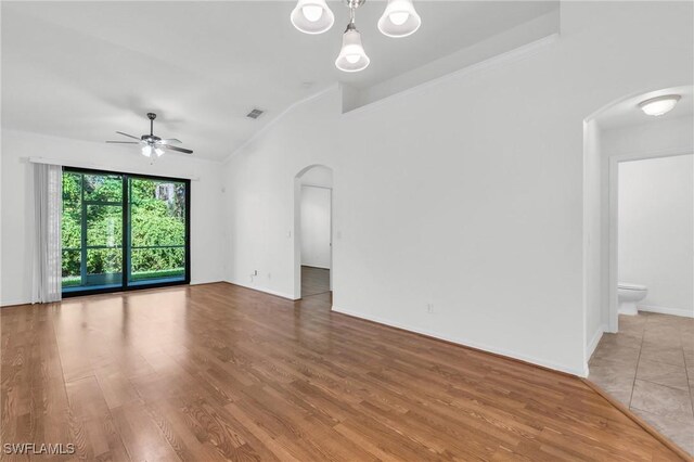 unfurnished room with ceiling fan, wood-type flooring, and crown molding