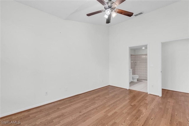 spare room featuring ceiling fan and light hardwood / wood-style flooring