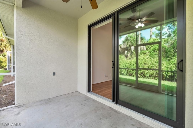 exterior space with ceiling fan