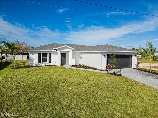 single story home with a garage and a front lawn