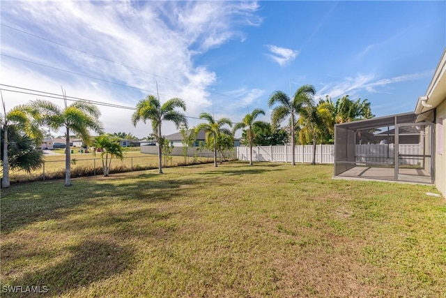 view of yard with a sunroom