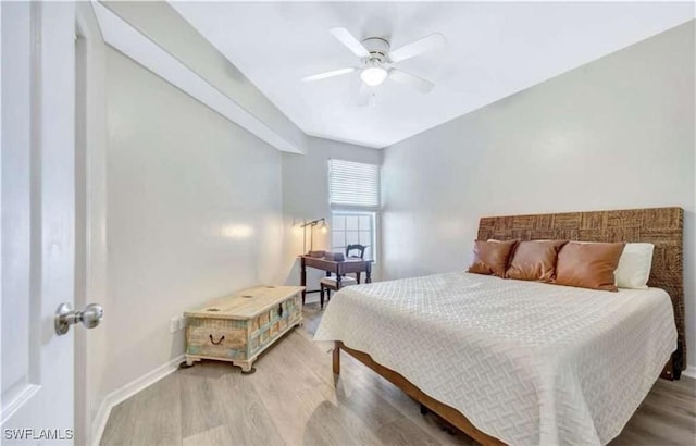 bedroom with ceiling fan and light wood-type flooring