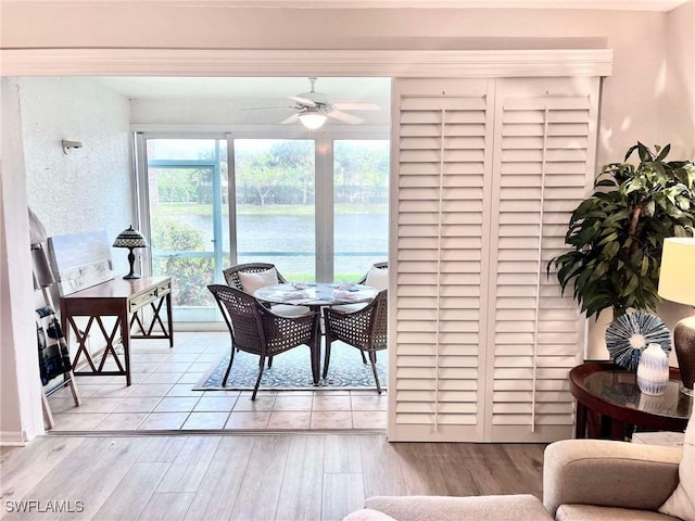 interior space with ceiling fan