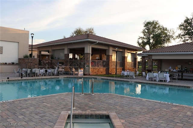 view of swimming pool featuring a patio area