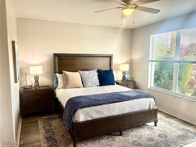 bedroom with wood-type flooring and ceiling fan