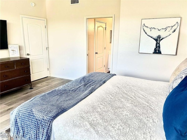 bedroom with light wood-type flooring