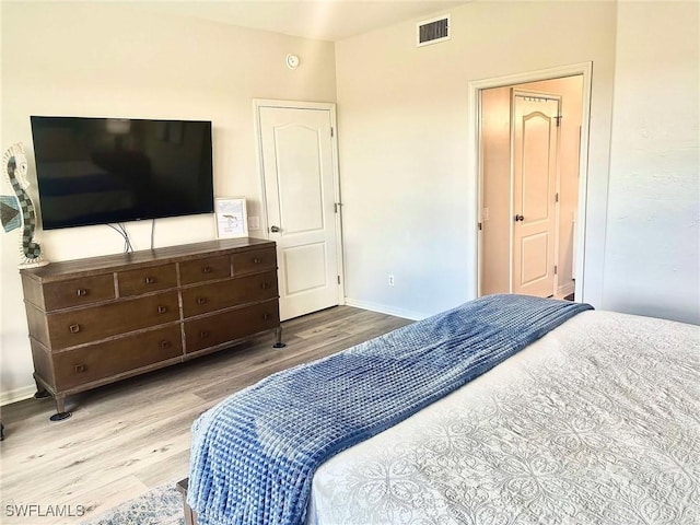 bedroom with light hardwood / wood-style flooring