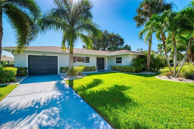 single story home with a front lawn and a garage