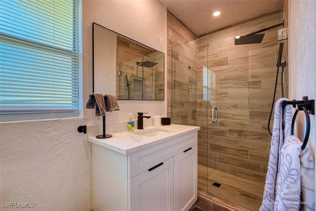 bathroom with vanity and an enclosed shower