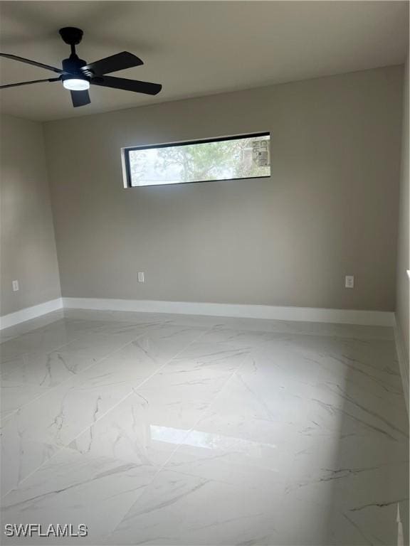 unfurnished room featuring plenty of natural light and ceiling fan