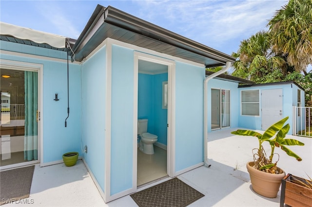 property entrance featuring a patio area