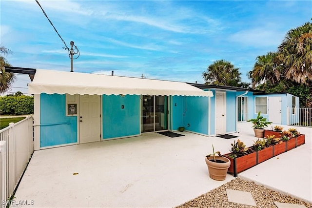 view of front of home featuring a patio