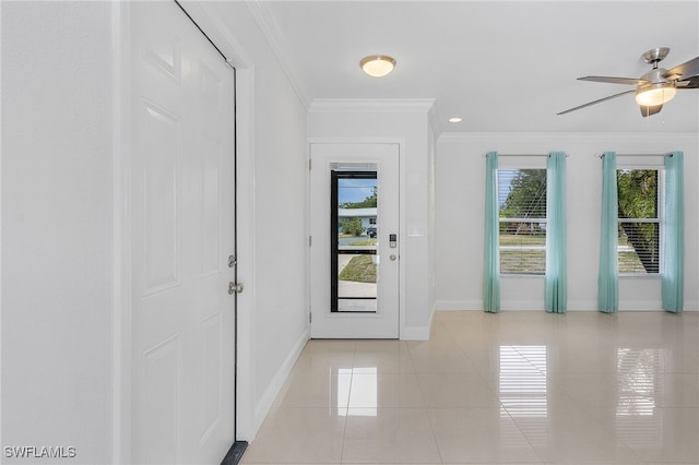 doorway with crown molding, light tile patterned flooring, and ceiling fan