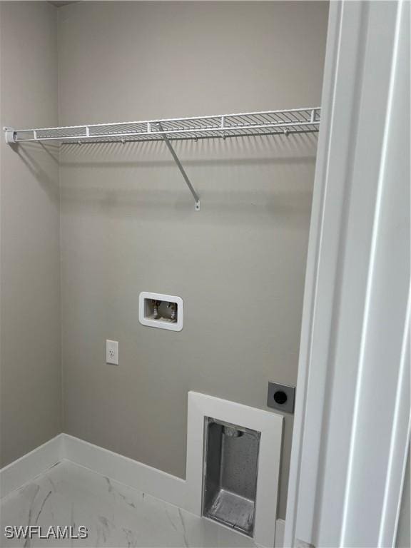 clothes washing area with hookup for an electric dryer and hookup for a washing machine