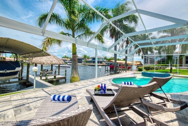 view of pool with a water view, a boat dock, a patio area, and glass enclosure