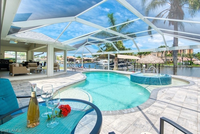 view of pool featuring glass enclosure, an outdoor hangout area, a water view, and a patio