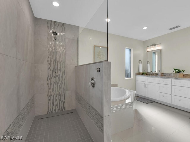 bathroom with tile patterned floors, vanity, and independent shower and bath