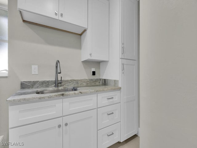 kitchen with white cabinets and sink