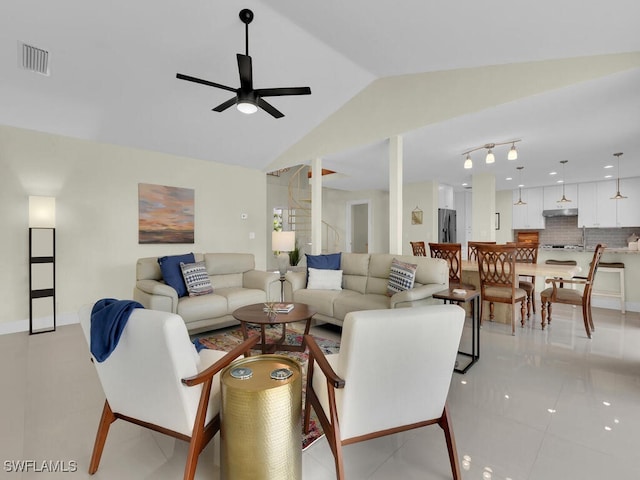 living room with ceiling fan, sink, and lofted ceiling