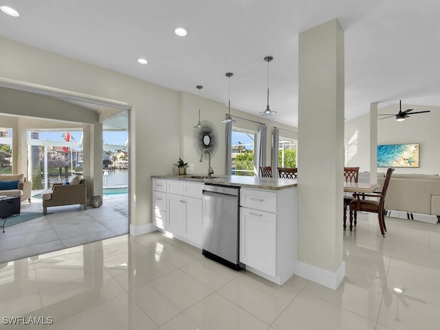 kitchen featuring decorative light fixtures, white cabinetry, light tile patterned floors, and dishwasher