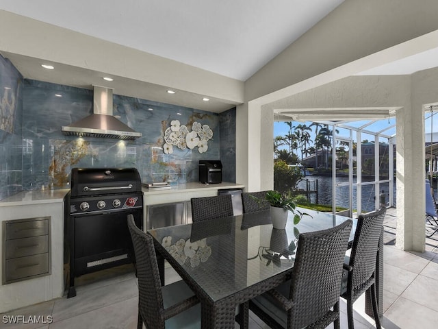 tiled dining space with a water view and lofted ceiling