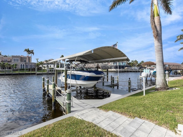 dock area with a water view and a yard