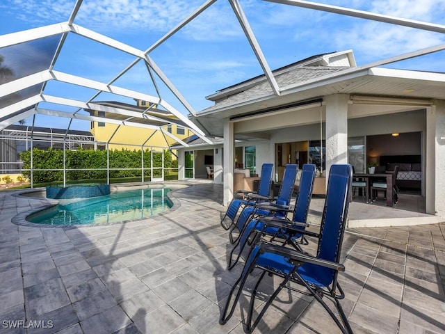 view of pool featuring a lanai and a patio