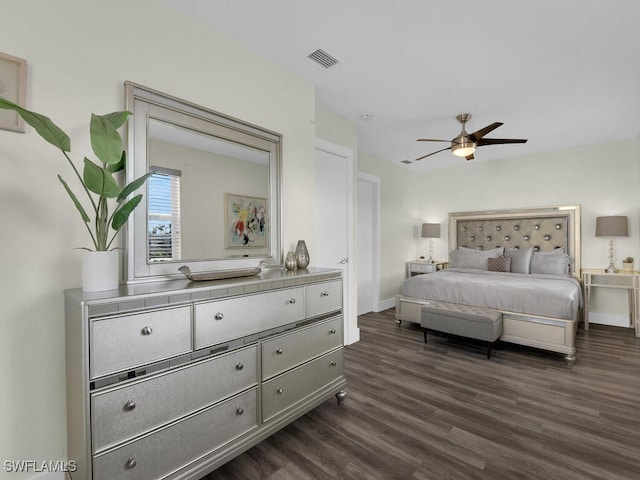 bedroom featuring ceiling fan and dark hardwood / wood-style flooring