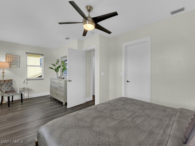 bedroom with ceiling fan and dark hardwood / wood-style floors