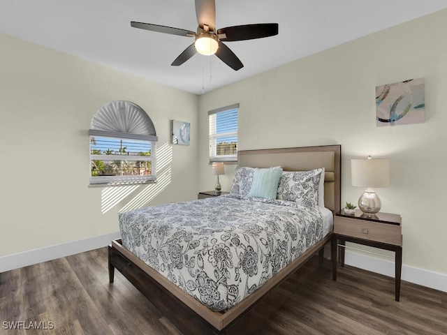 bedroom featuring ceiling fan and dark hardwood / wood-style flooring