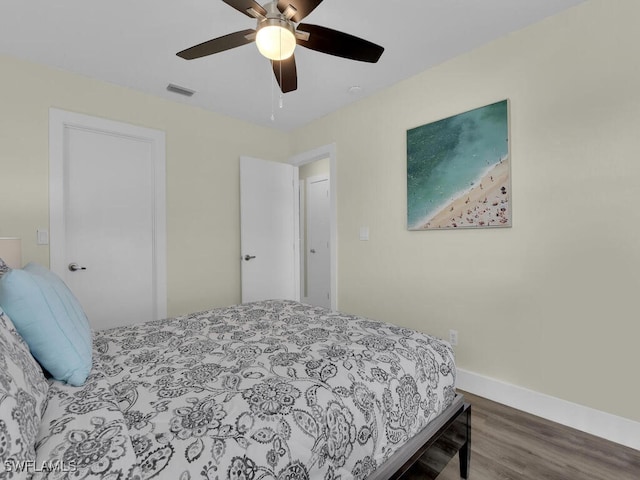 bedroom with ceiling fan and hardwood / wood-style flooring