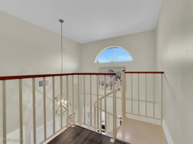 stairs with hardwood / wood-style floors