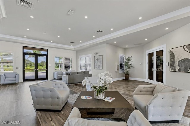 living room with french doors and hardwood / wood-style floors