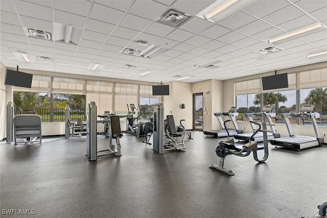 workout area featuring a drop ceiling