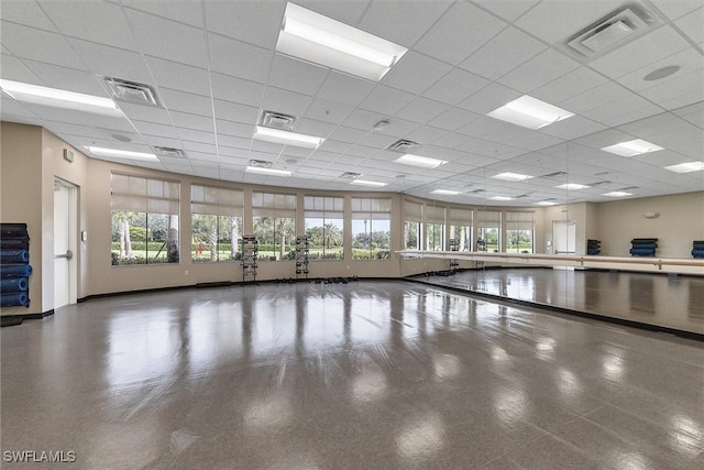 interior space featuring a drop ceiling