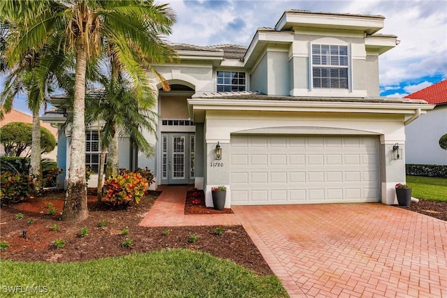 view of front of property with a garage