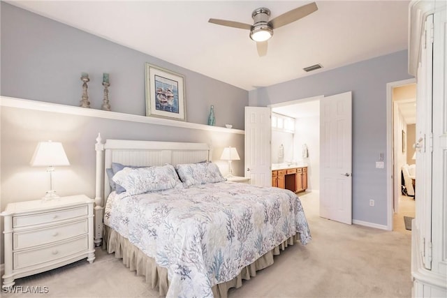 carpeted bedroom featuring connected bathroom and ceiling fan