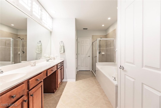 bathroom with tile patterned floors, separate shower and tub, and vanity