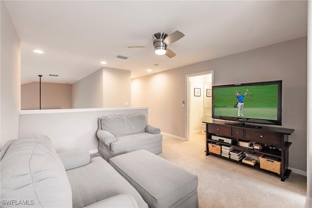 carpeted living room featuring ceiling fan and lofted ceiling