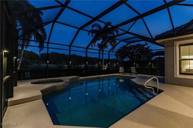 view of pool with an in ground hot tub, a patio, and glass enclosure